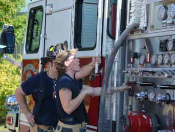 Fire Fighters Maintaining Fire Truck